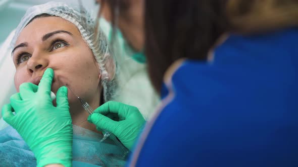 Client at Procedure of Antiaging Facial Filler Injection alt