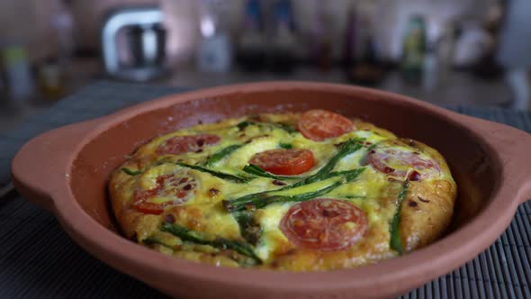 Vegetable frittata with egg, tomato, pepper, onion, cheese and green wild garlic alt