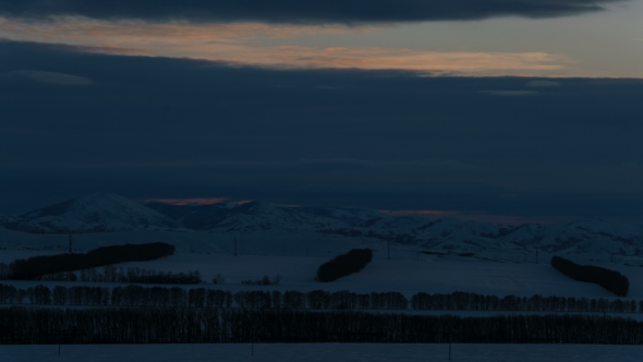 Beautiful Sunrise in Winter Snowy Mountains