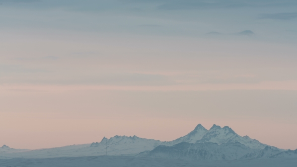 Beautiful Sunrise in Winter Snowy Mountains