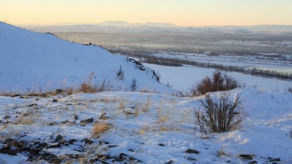 of Beautiful Sunrise in Winter Snowy Mountains.