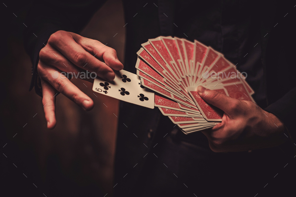 Man showing tricks with cards - Stock Photo - Images