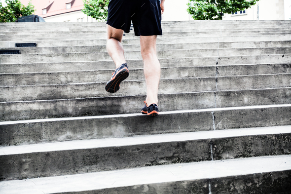 Man running on stairs, training
