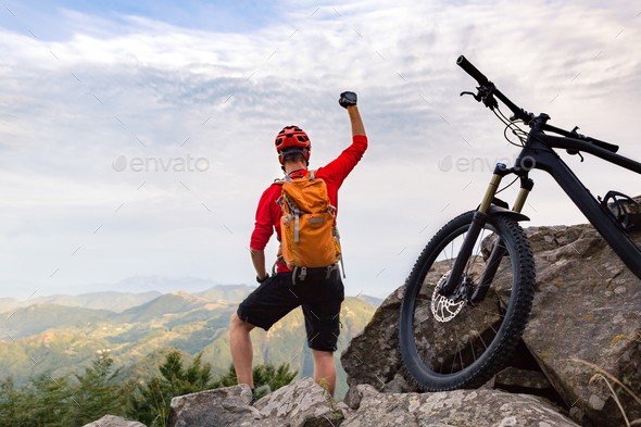 Mountain biker success, looking at mountains view