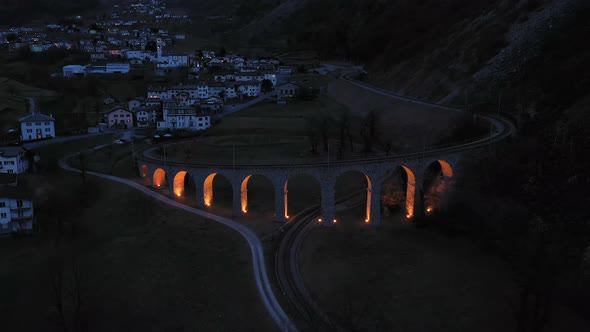 Illuminated Brusio Spiral Viaduct in Switzerland alt