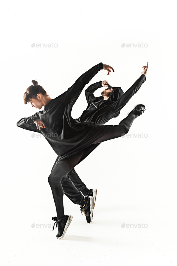 The silhouettes of two hip hop male and female break dancers dancing on  white background Stock Photo by master1305