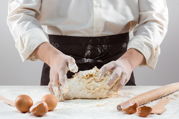 Hands kneading a dough - Stock Photo - Images