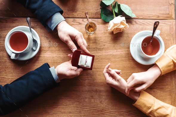 Female and male hands with wedding ring top view - Stock Photo - Images