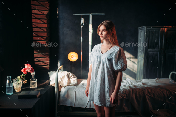 Ill woman in hospital, drip and bed on background - Stock Photo - Images