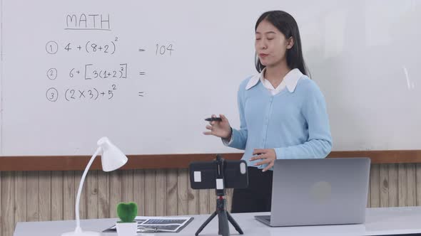 Teachers are teaching through laptops or broadcasting live in the classroom. alt