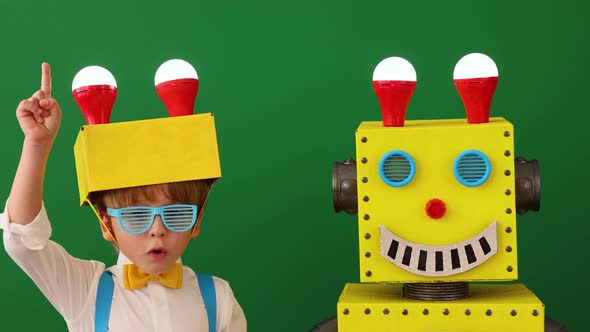 Happy child with toy robot in class. Slow motion