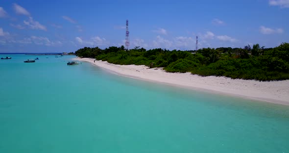 Wide angle fly over abstract shot of a sandy white paradise beach and aqua blue water background in  alt