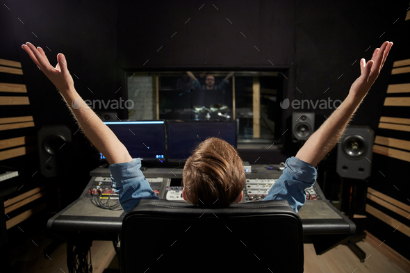 man at mixing console in music recording studio - Stock Photo - Images