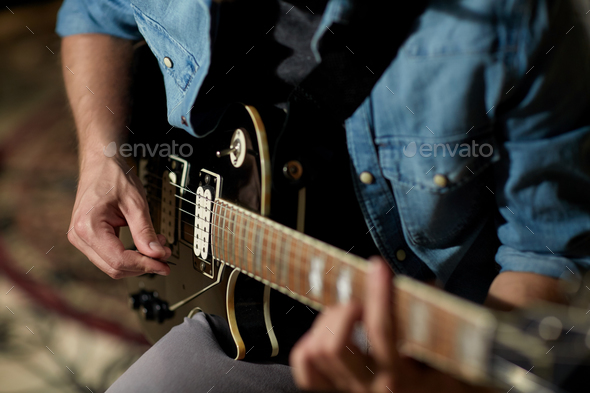 Close Up Of Man Playing Guitar At Studio Rehearsal Stock Photo By Dolgachov