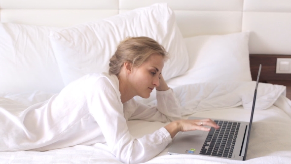 Woman in Bed with Laptop