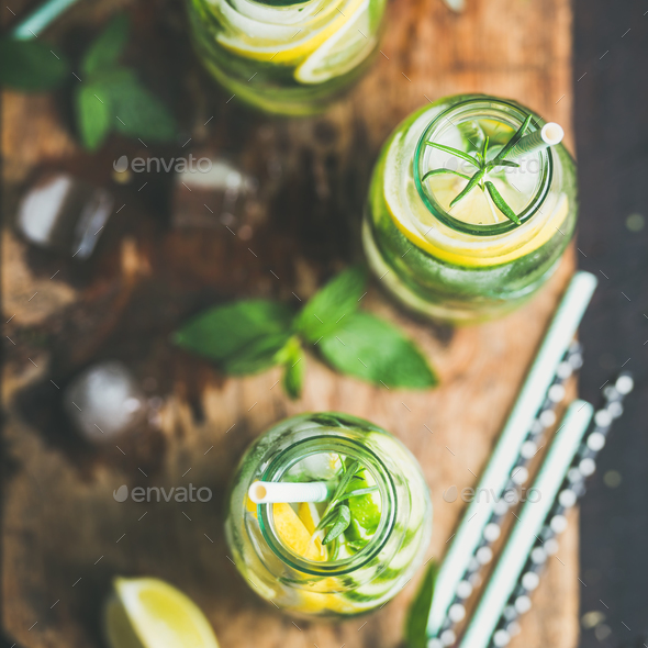 Healthy infused citrus sassi water in glass bottles, square crop - Stock Photo - Images