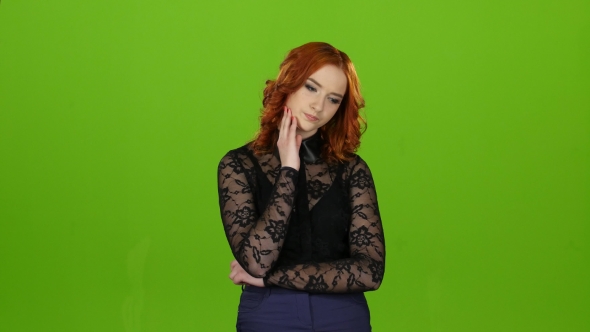 Girl Looks Up Thoughtfully and Analyzes the Meaning of Life. Green Screen alt