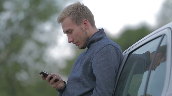 Young Man Using a Smartphone