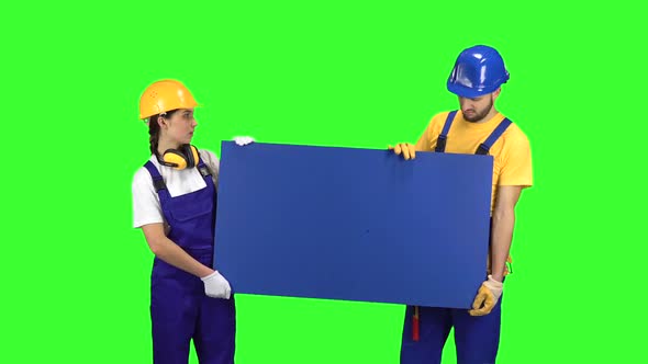 Engenners of the Guy with the Girl Touting the Product and Show Their Thumbs Down . Green Screen alt