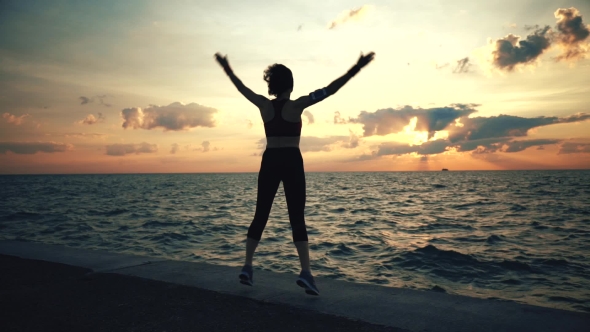 Runner Athlete Doing Exersises at Seaside