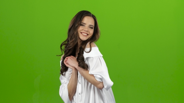 Girl Experiences Happiness, Shows Her Thumbs Up, Smiles Sweetly. Green Screen alt