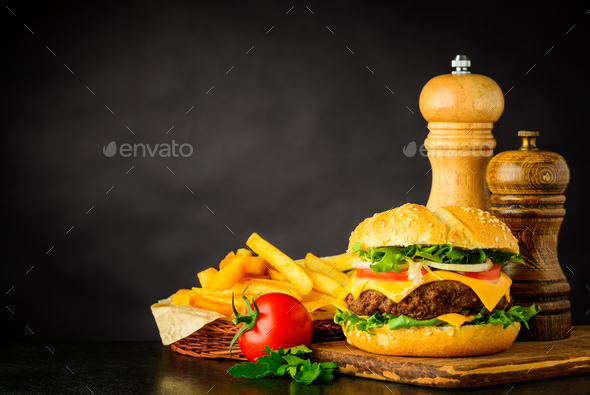 Cheeseburger with French Fries and Copy Space - Stock Photo - Images