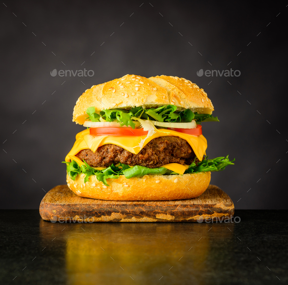 Cheeseburger Sandwich on Dark Background - Stock Photo - Images