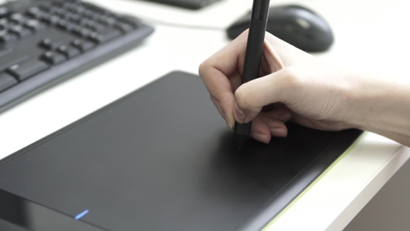 Graphic Designer Using Drawing Tablet