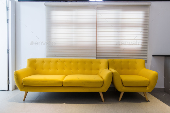 taktik Pornografi Bløde Modern yellow sofa and chair in room interior at home or hotel Stock Photo  by romankosolapov