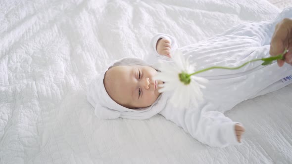 Directly Above Cute Little Baby on Bed