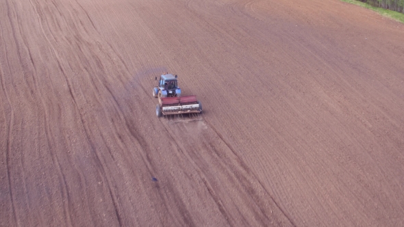 Aerial View of Tractor on Prepare a Field for Planting