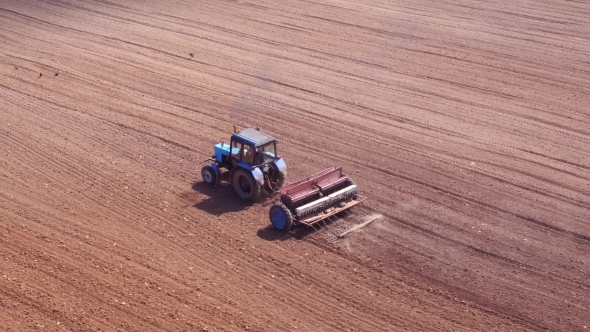 Aerial View of Tractor on Prepare a Field for Planting