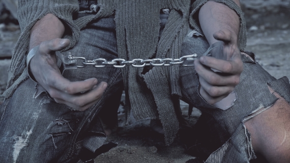 Prisoner in Chains on His Knees alt