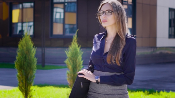 The Sexy Business Lady Is on High Heels Along the Street Next To the ...