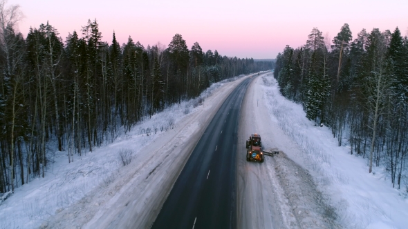 Intercity Highway Among Woodland at Sunset in Winter