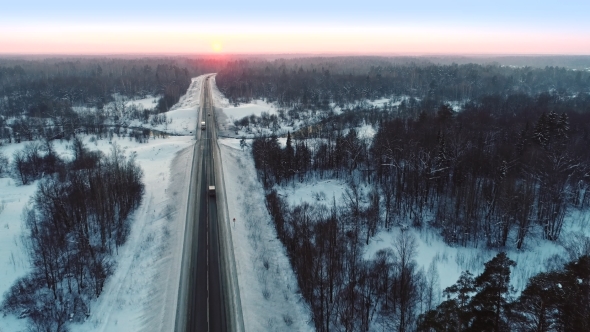 Intercity Highway Among Woodland at Sunset in Winter