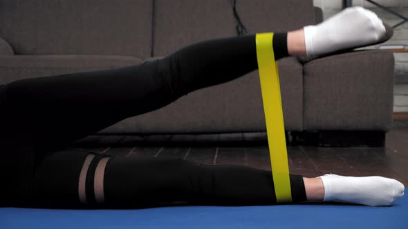Athletic Woman Sportswoman Doing Legs Exercise with Loop Band on Fitness Mat alt