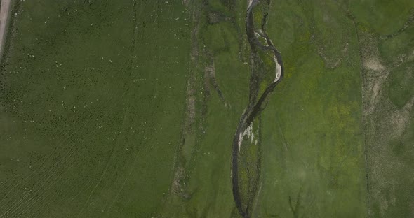 Top View Of Vast Pasture Land With Flowing River At Ktsia-Tabatskuri Managed Reserve In Samtskhe-Jav alt