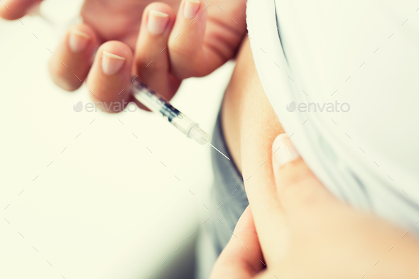 woman with syringe making insulin injection - Stock Photo - Images