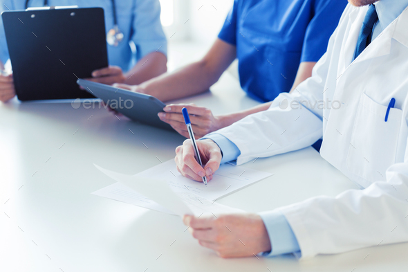 close up of happy doctors at seminar or hospital - Stock Photo - Images