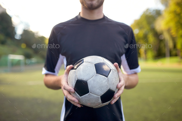 Close Up Of Soccer Player With Football On Field Stock Photo By Dolgachov