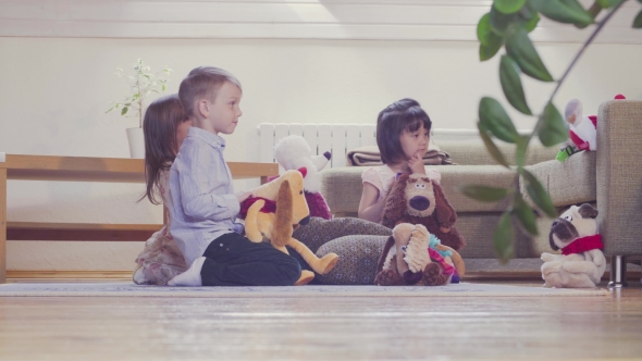 A Group of Children Playing Stuffed Toys