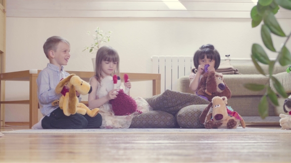 A Group of Children Playing Stuffed Toys