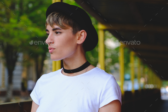 Portrait of female hipster with natural makeup and short haircut enjoying  leisure time outdoors Stock Photo by arthurhidden