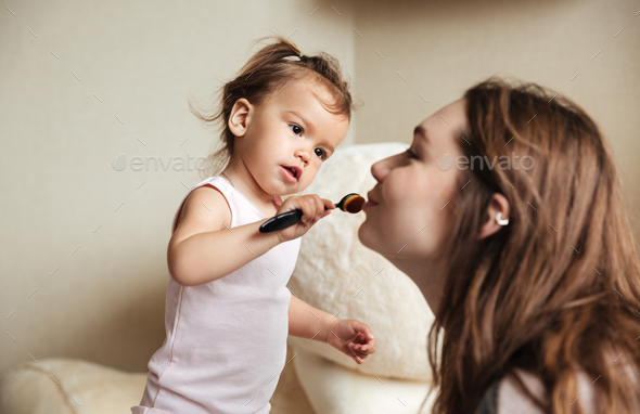 Little Cute Girl Does A Makeup For Her