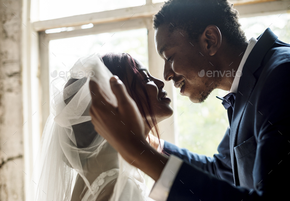 Newlywed African Descent Groom Open Bride Veil Wedding Celebrati