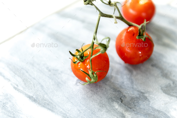 Tomatoes on a marble background - Stock Photo - Images