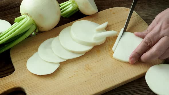 Sliced daikon radish.Tasty fresh crude white round japanese radish.