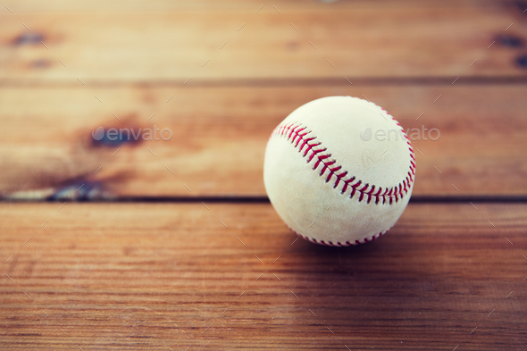 close up of baseball ball on wooden floor