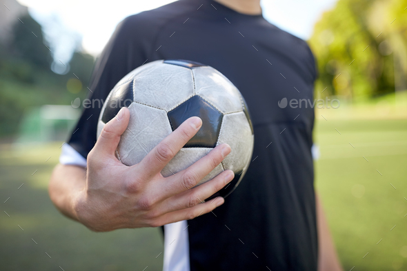 Close Up Of Soccer Player With Football On Field Stock Photo By Dolgachov